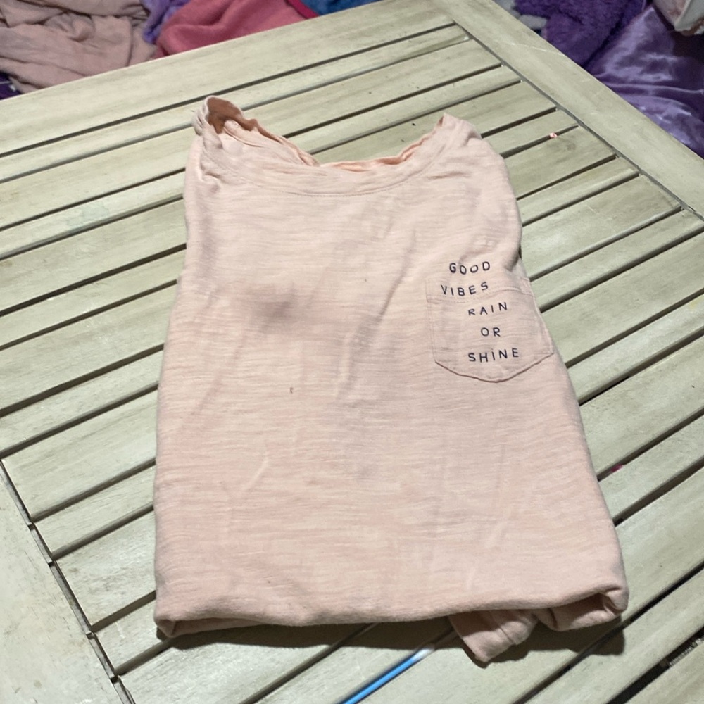 It’s an old navy shirt with a pocket with print that says good vibes